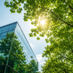 Modern sustainable office building surrounded by green trees representing Elbow Beach Capital's investment in climate technology startups